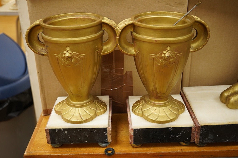 A French Art Deco figural and rouge marble clock garniture, 56cm wide. Condition - poor